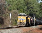 NS train 64D, led by UP 7875, splits the signals